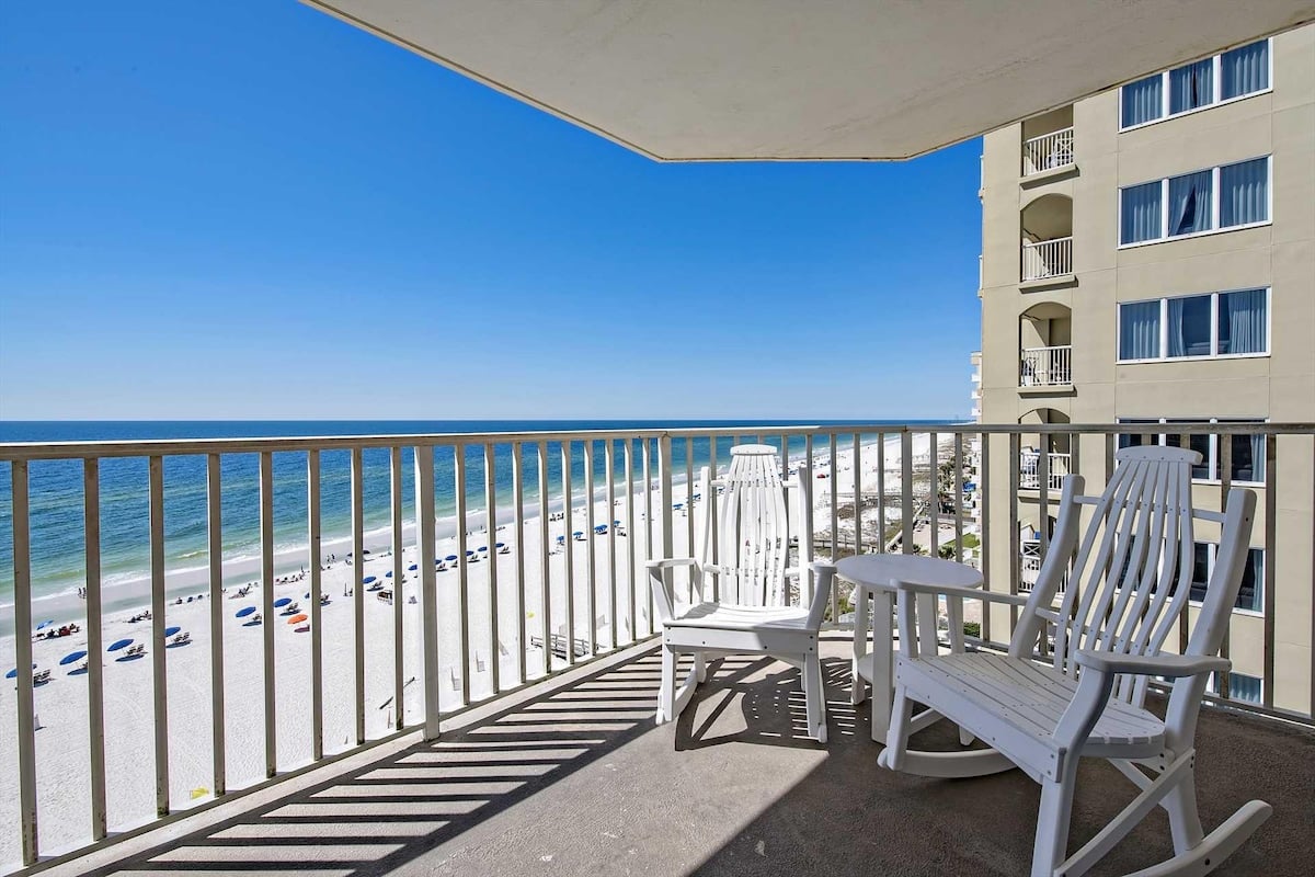 White balcony chairs overlooking the beach and Gulf at Four Winds 904 in Orange Beach Alabama