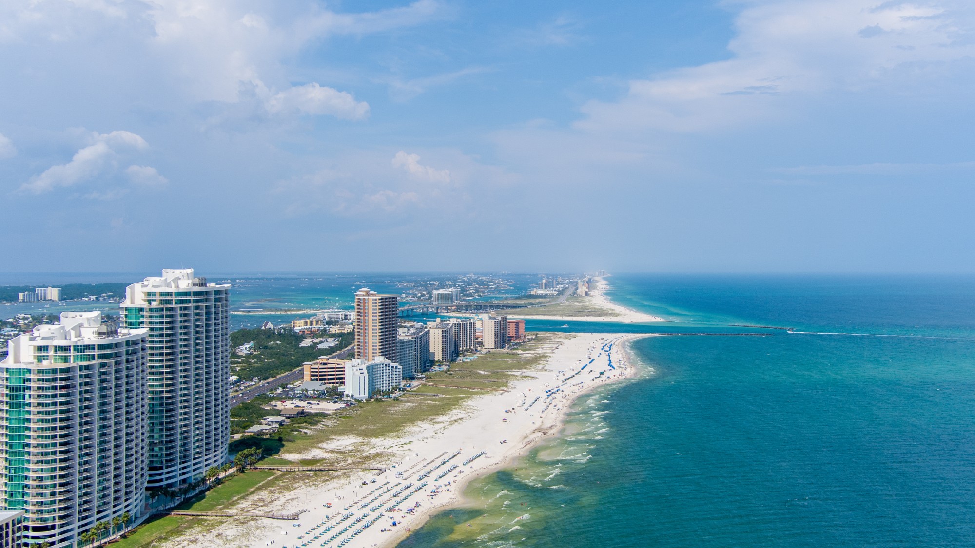 Aerial view of Orange Beach condo towers and white sand beach along the Alabama Gulf coast