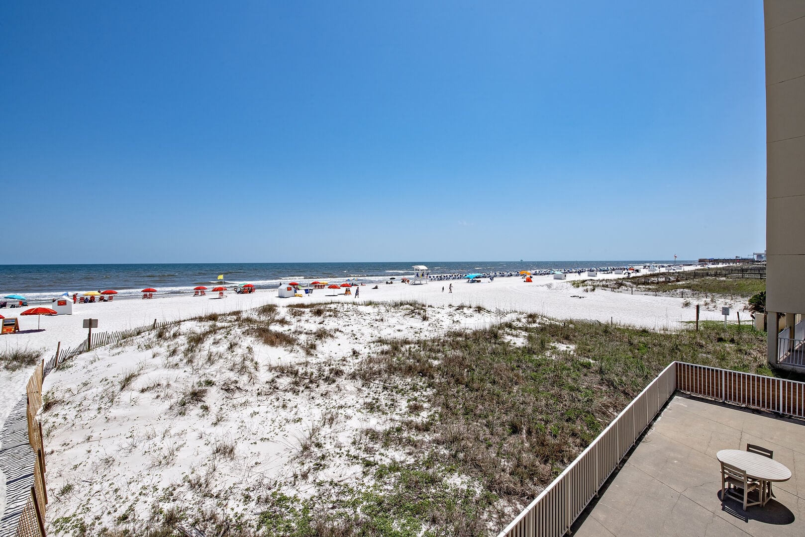 Patio overlooking the dunes and beach at Gulf House in Gulf Shores, Alabama