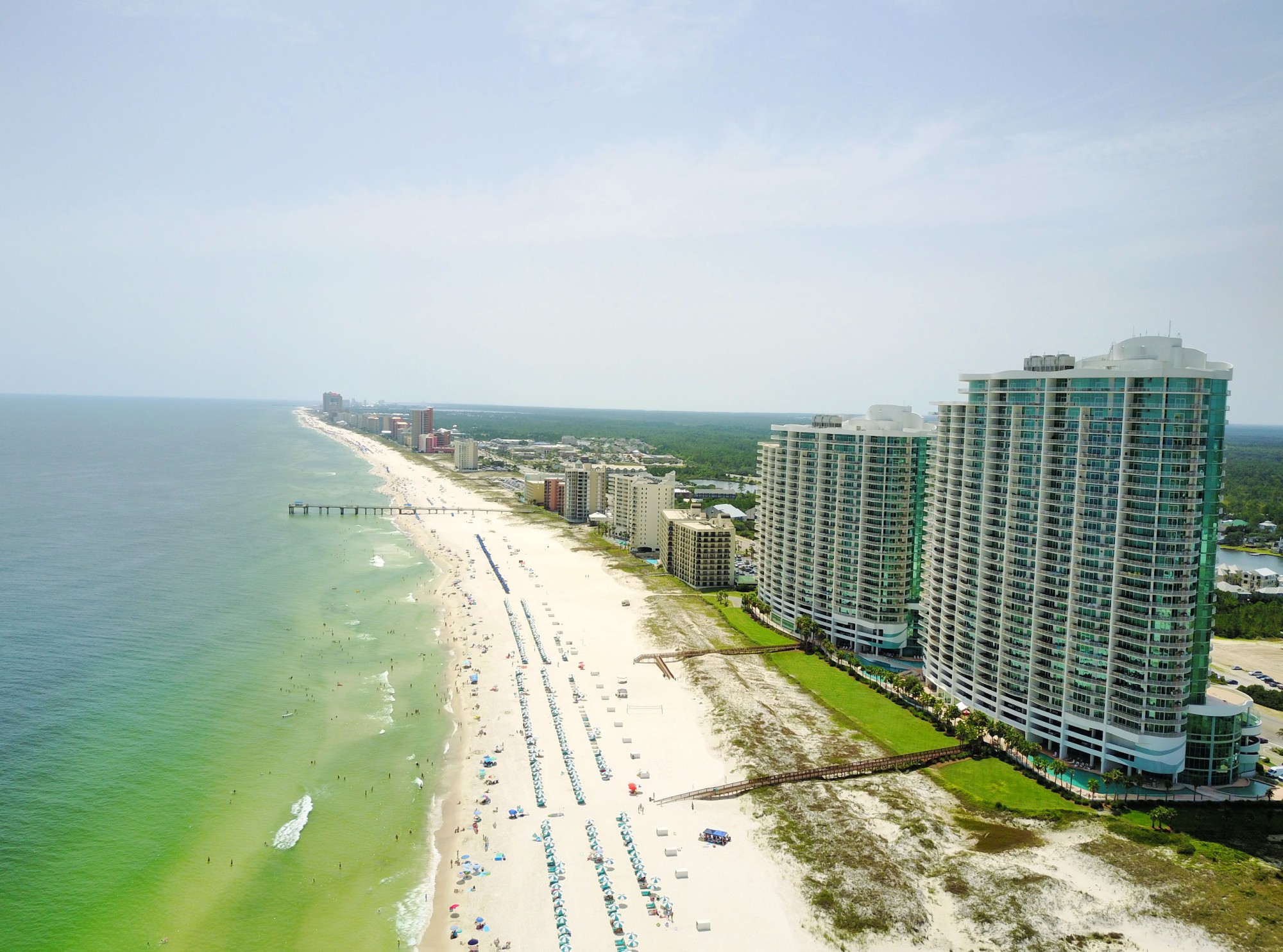 Aerial view of Orange Beach condo towers and beach, browse vacation rentals by complex