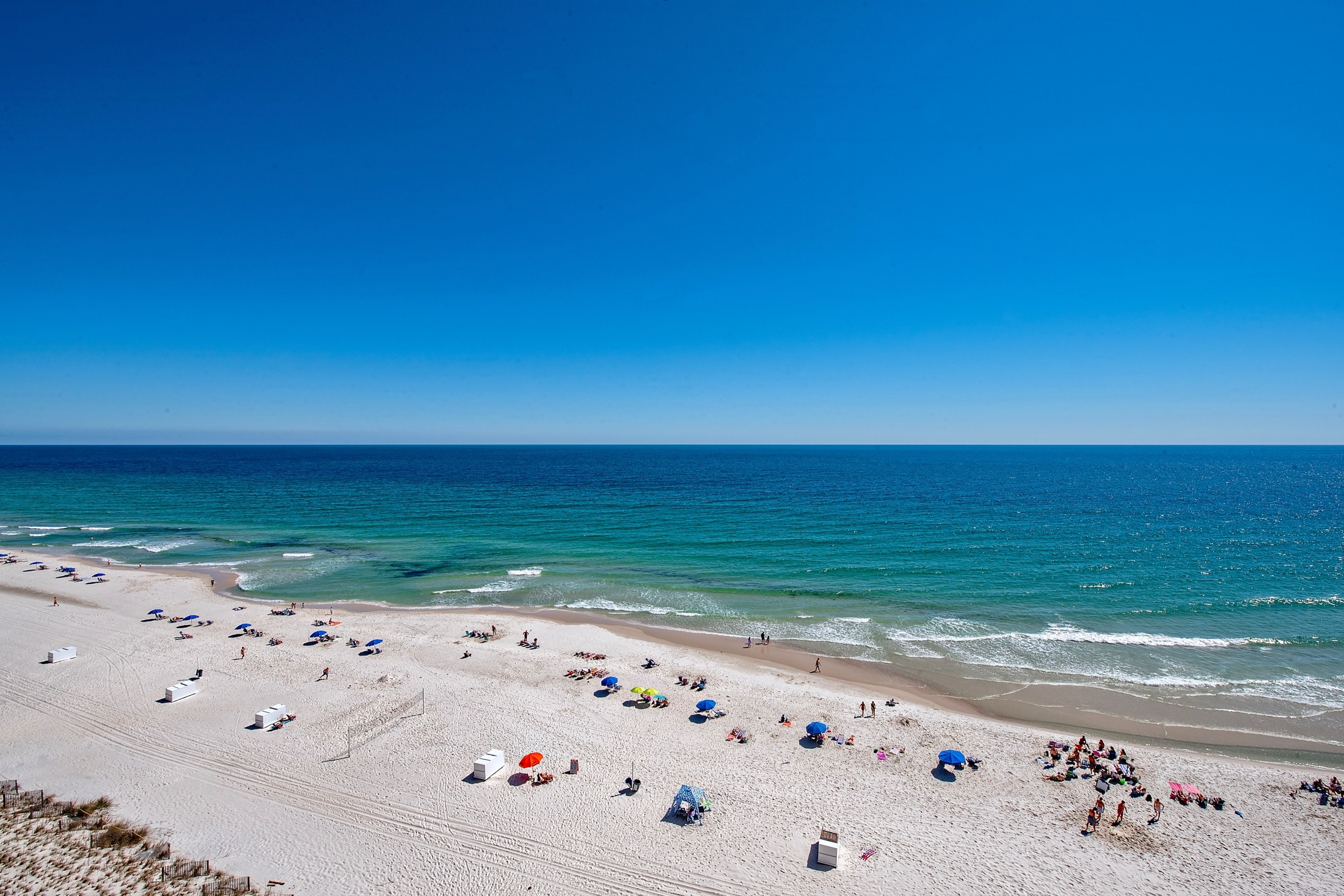 White sand beach and blue Gulf at Crystal Shores West condos in Gulf Shores Alabama
