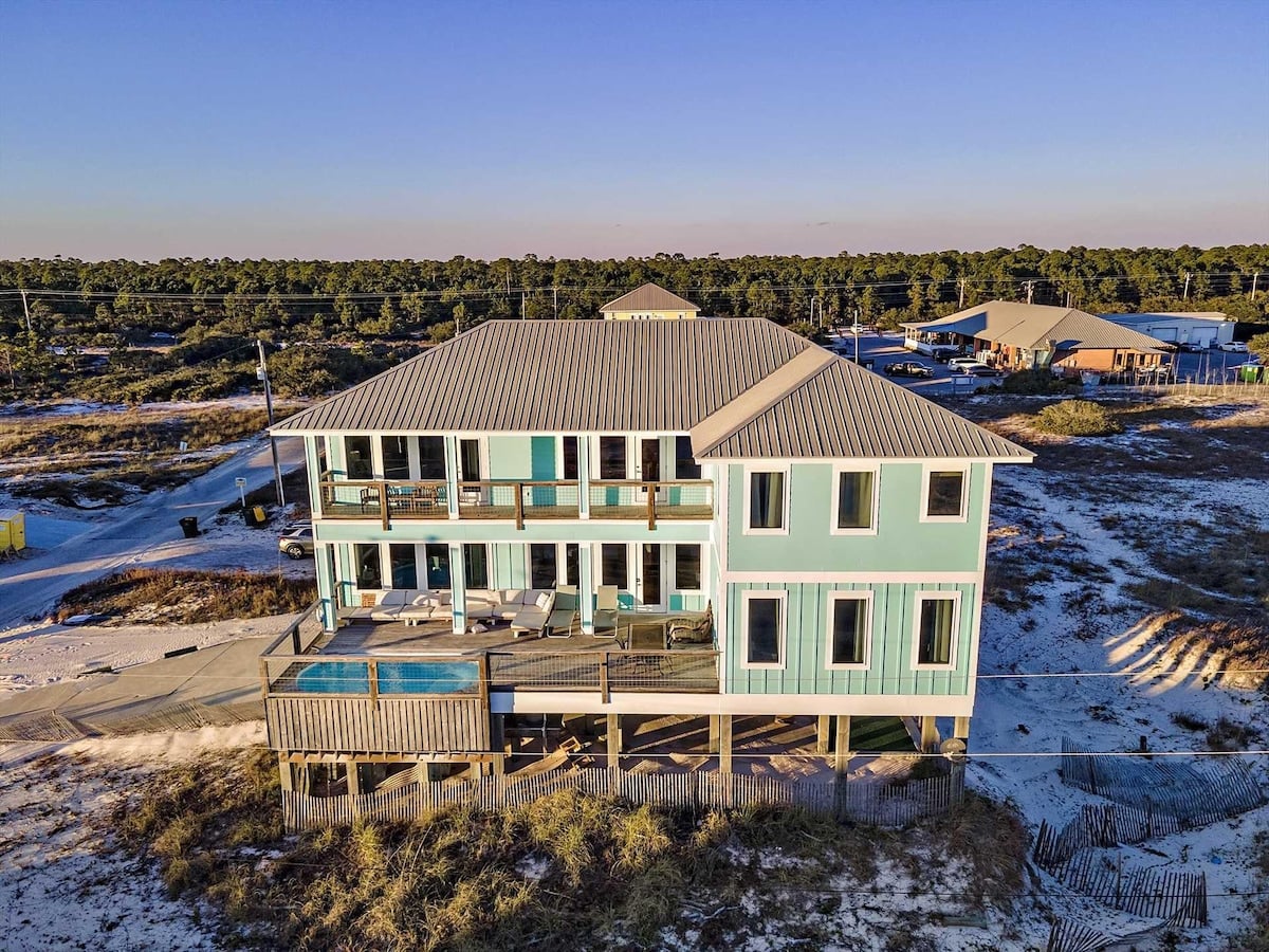 Green beach house with private pool at All Ours in Fort Morgan, Alabama