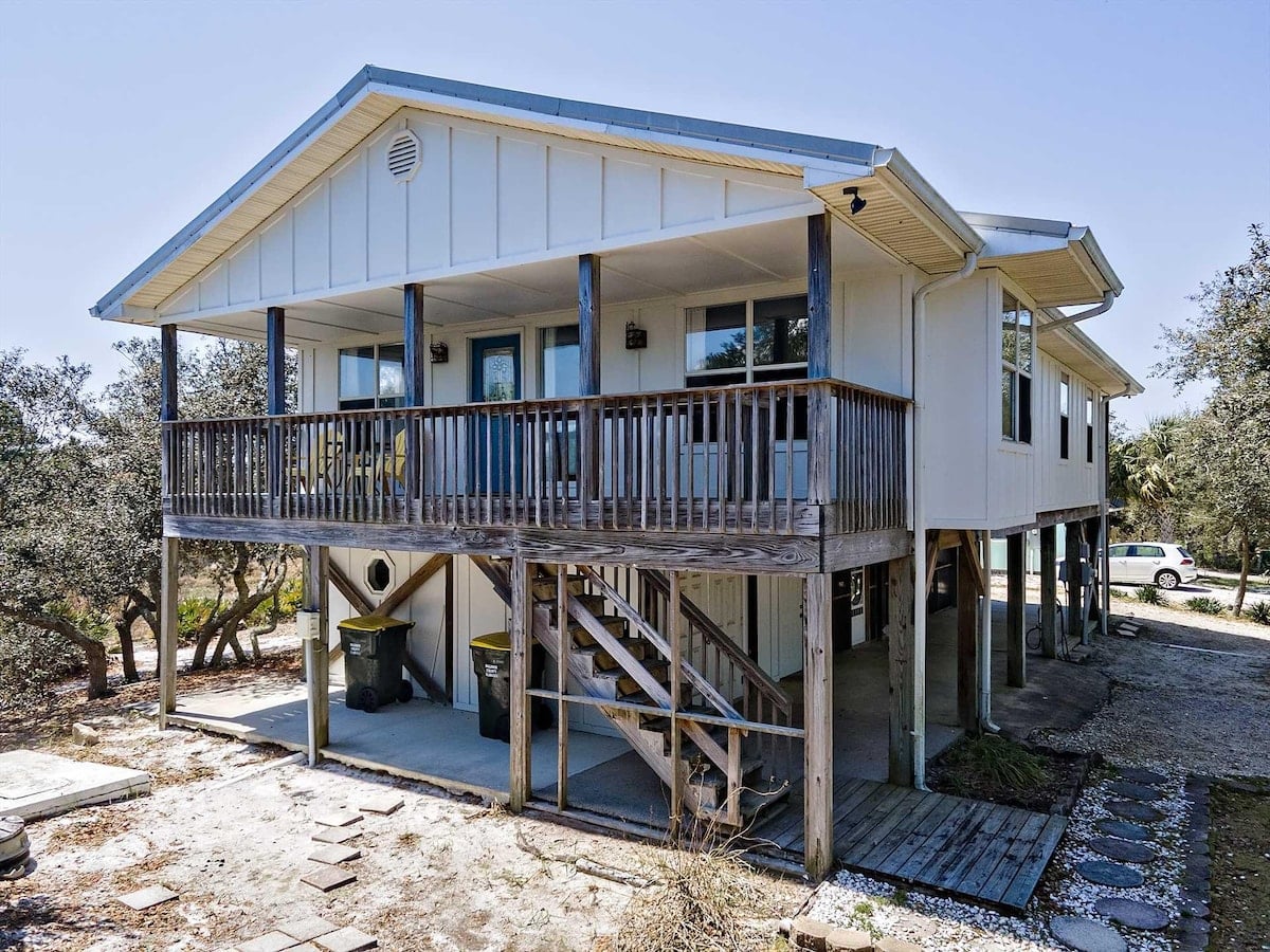 Beach cottage with wide deck at Barefoot Days in Fort Morgan, Alabama