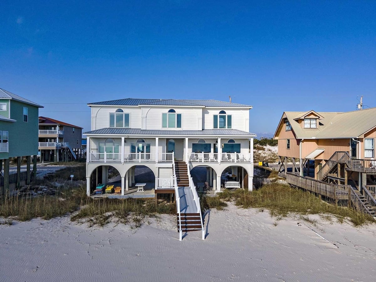 Beach house on the sand with covered porches at Beach Stop 2 in Fort Morgan, Alabama
