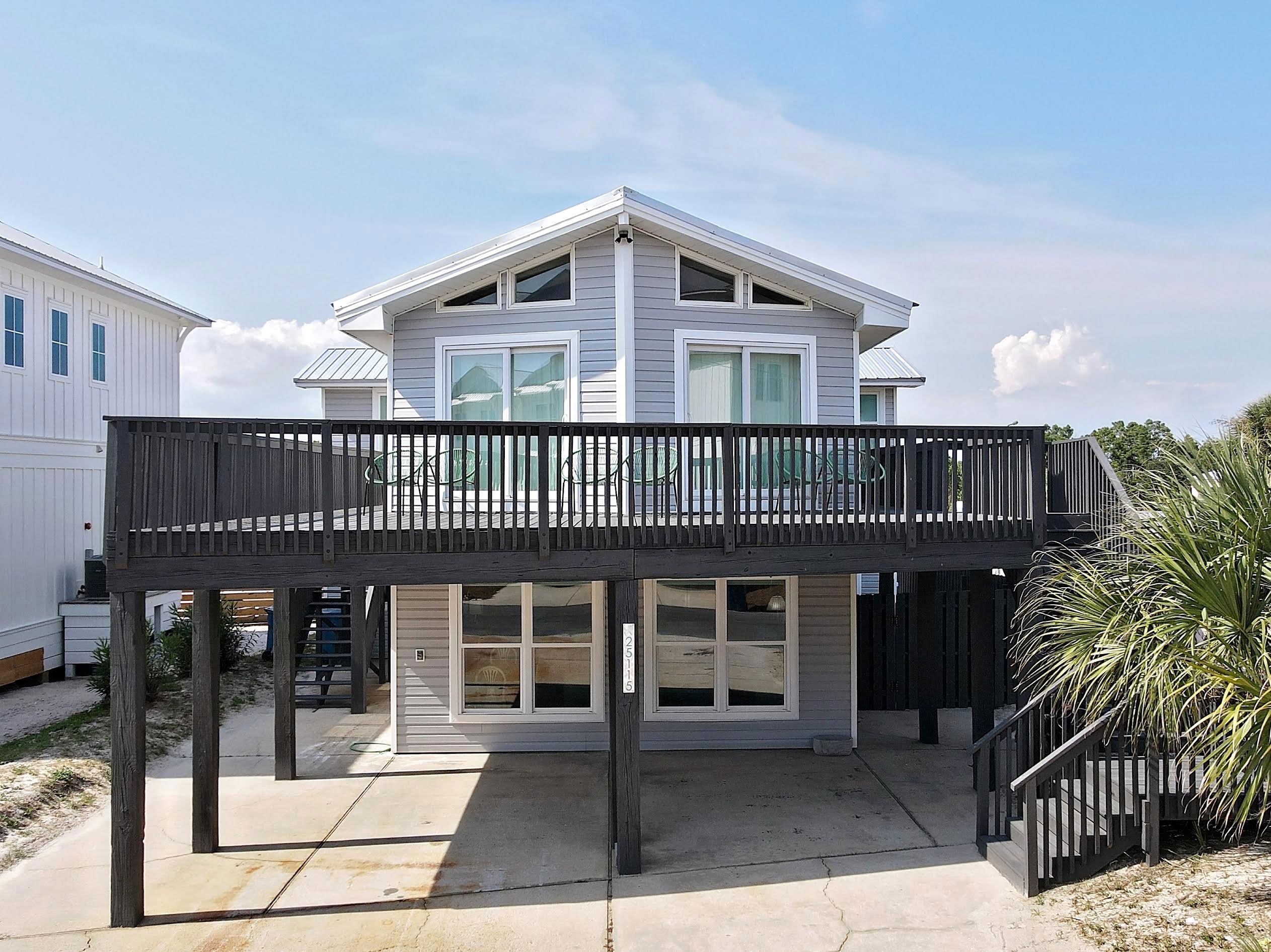 Gray beach house with deck at Belle Vista in Orange Beach, Alabama