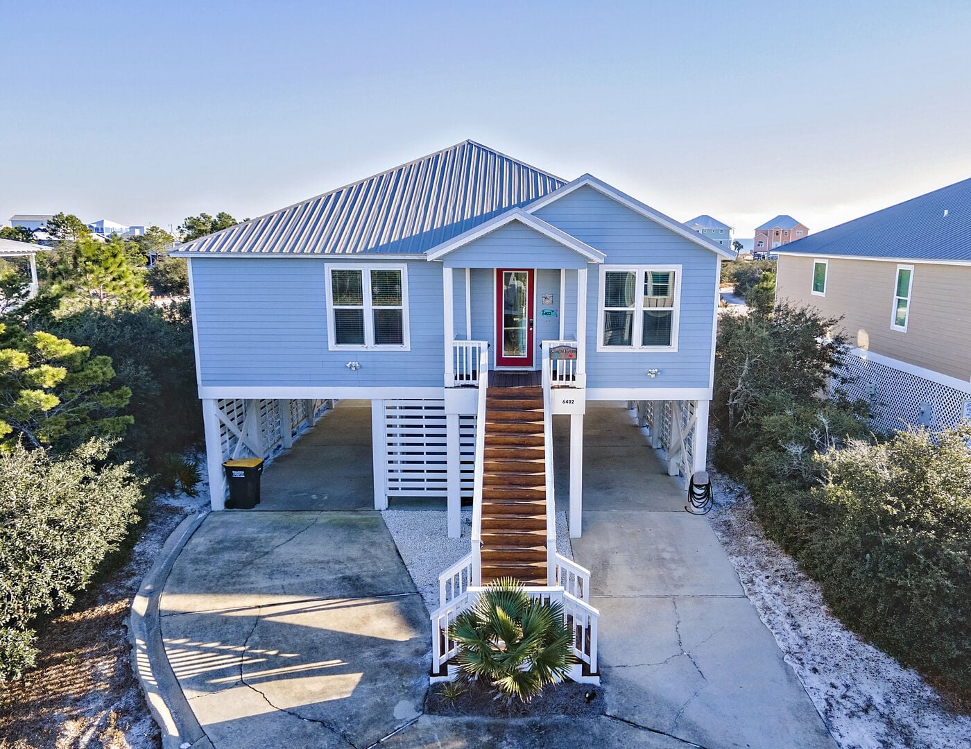 Light blue beach house with front stairs at Blue Pearl in Fort Morgan, Alabama