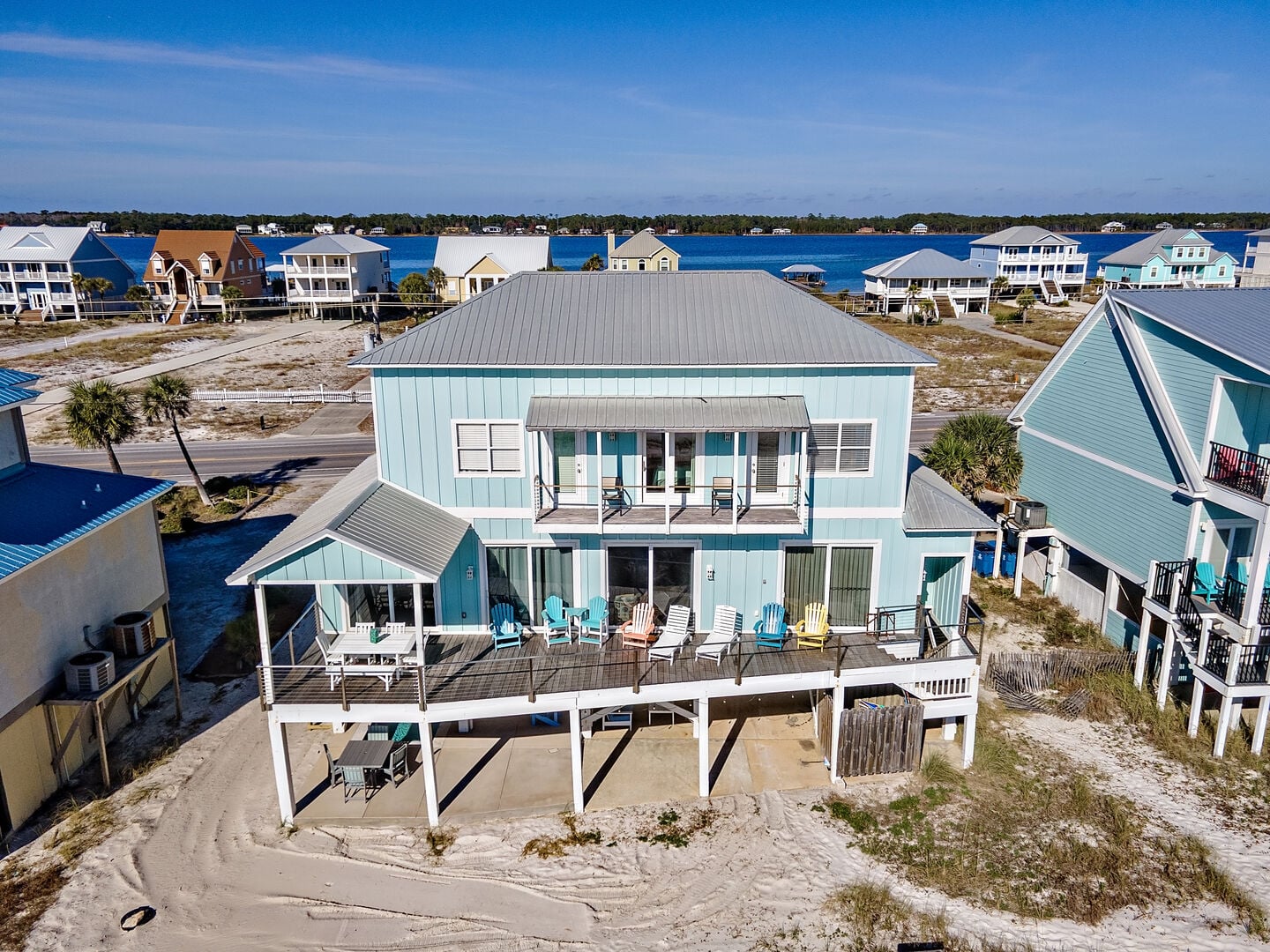 Light blue beach house with wraparound deck at Calypso Cabana in Gulf Shores, Alabama