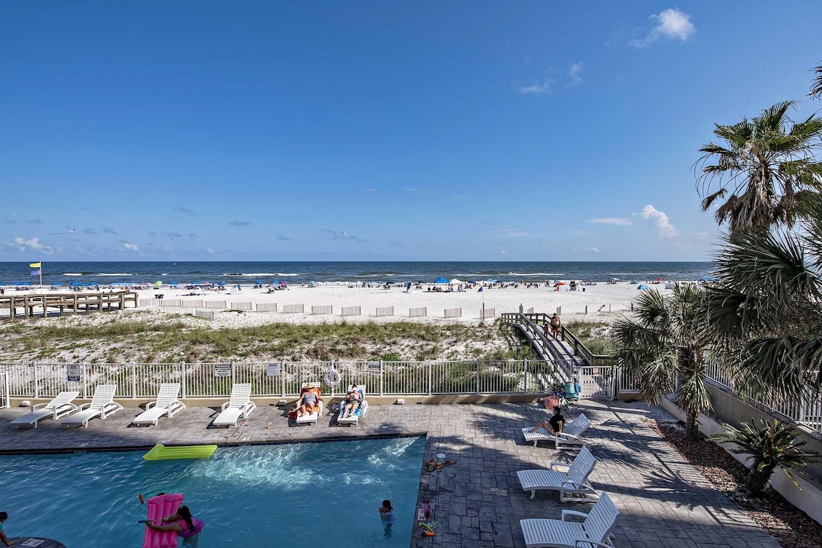 Pool deck and boardwalk to the beach at Four Winds in Orange Beach, Alabama