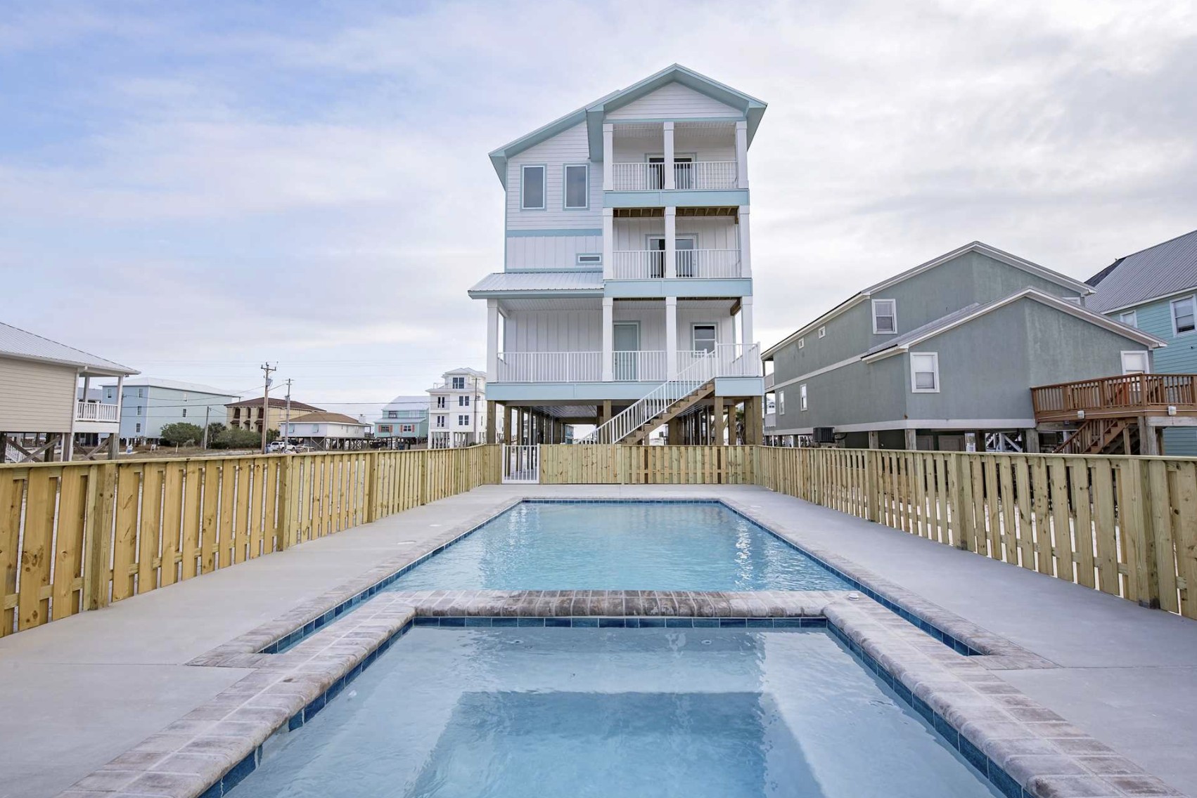 Private pool with beach house behind at GET Relaxin in Gulf Shores, Alabama