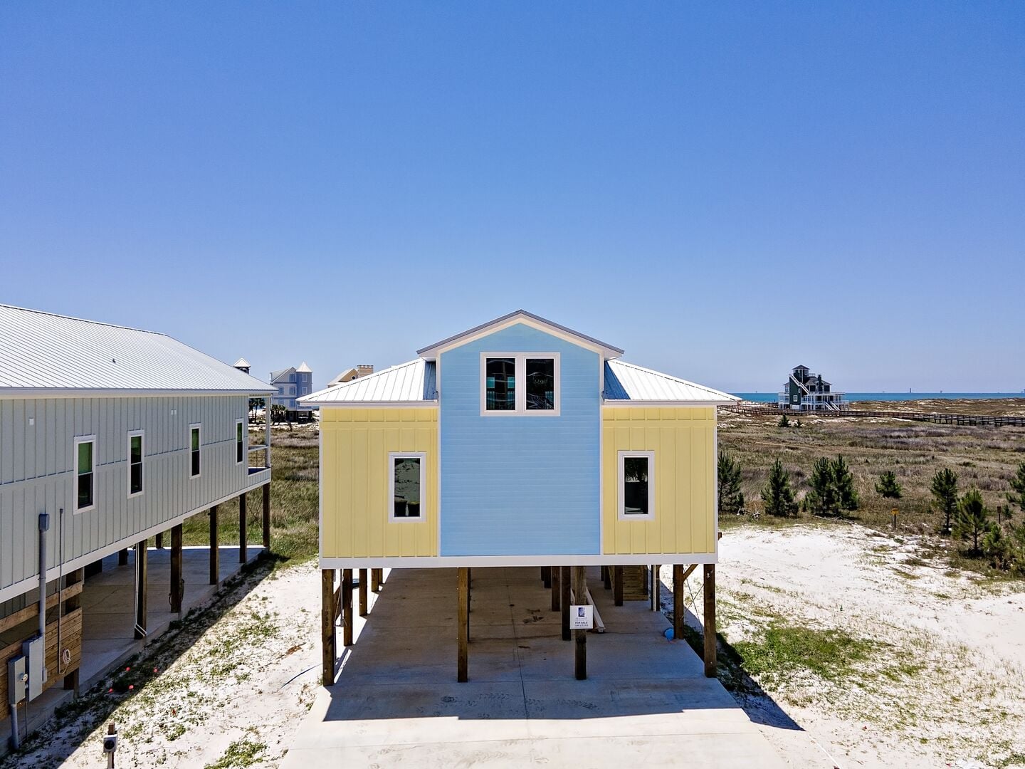 Yellow and blue beach house at Hidden Jewell in Fort Morgan, Alabama