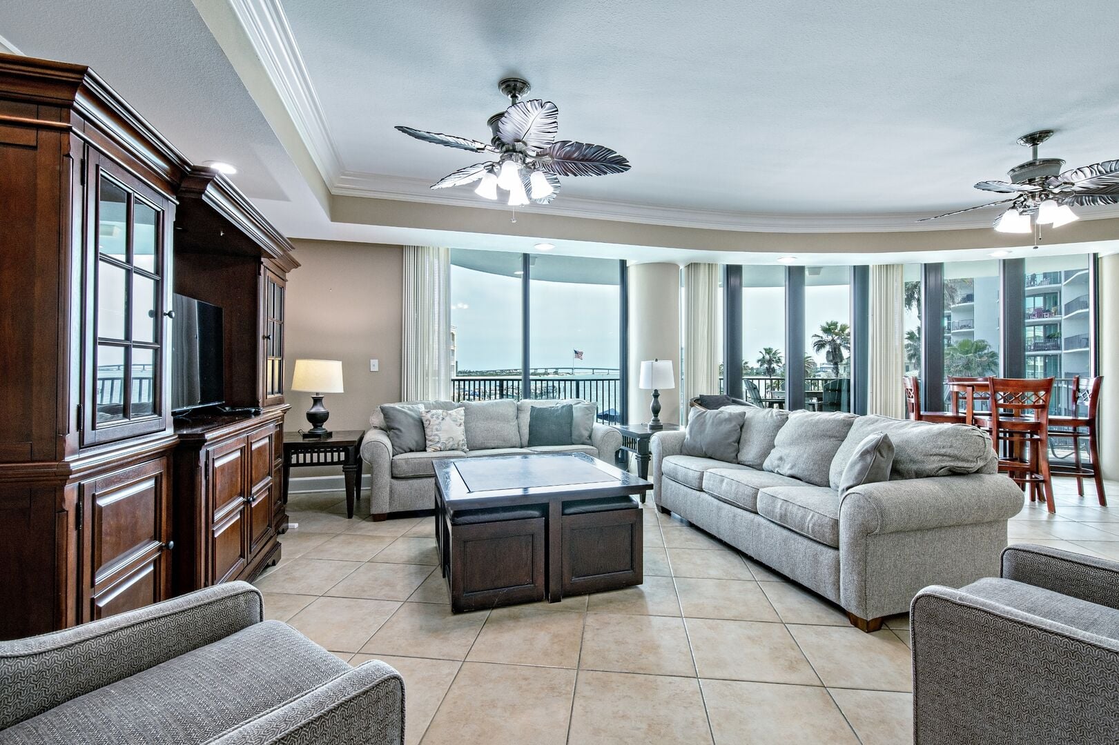 Living room with large windows at Lighthouse on the Bay in Orange Beach, Alabama