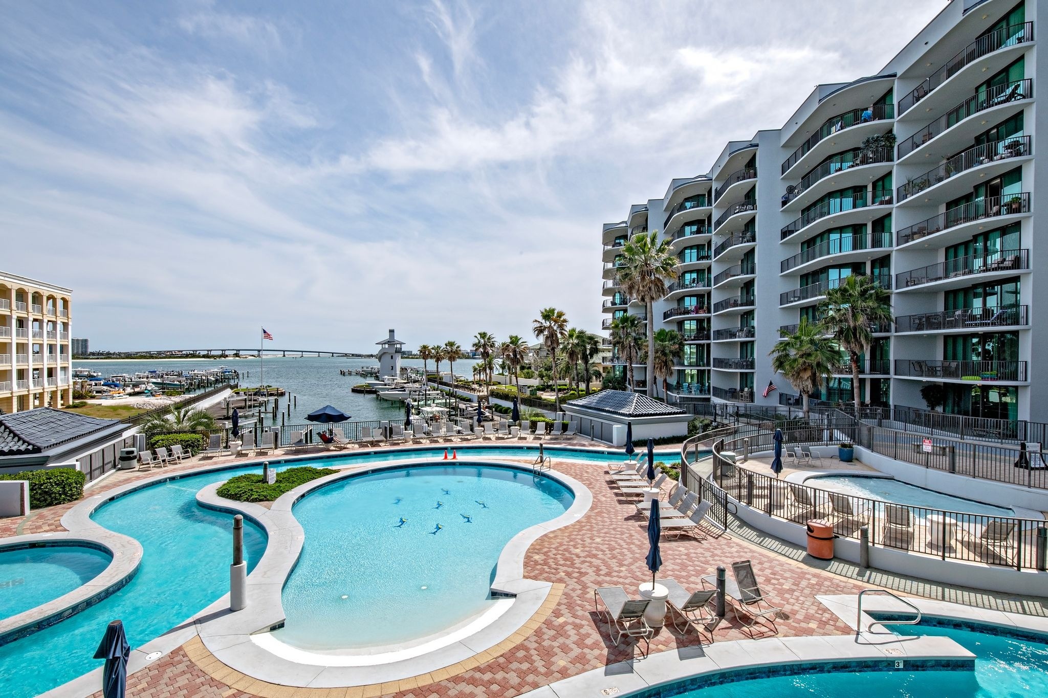 Balcony view of the pool and bay from unit 2212 at Lighthouse on the Bay in Orange Beach, Alabama