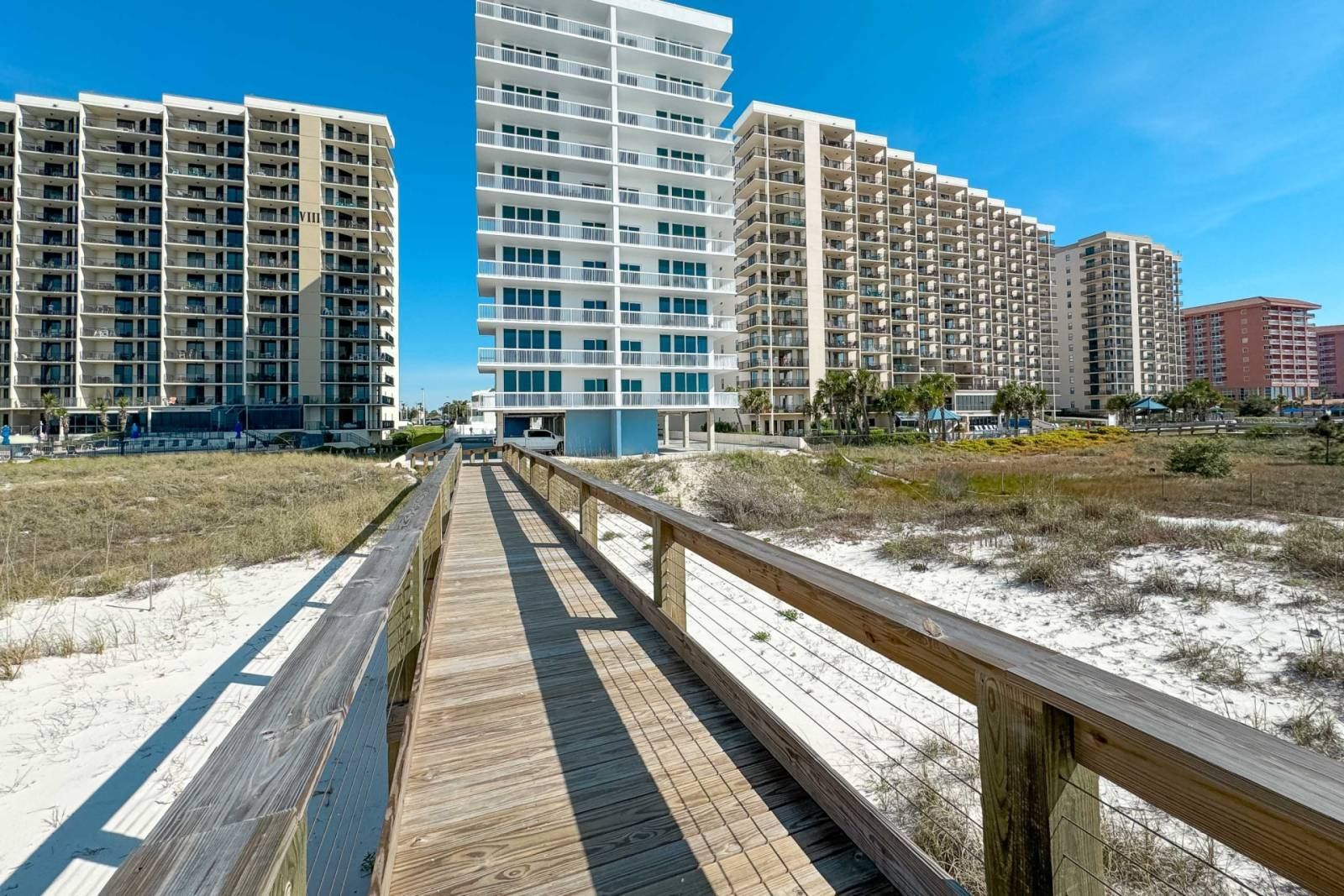 White sand beach in front of Perdido Dunes Tower in Orange Beach, Alabama