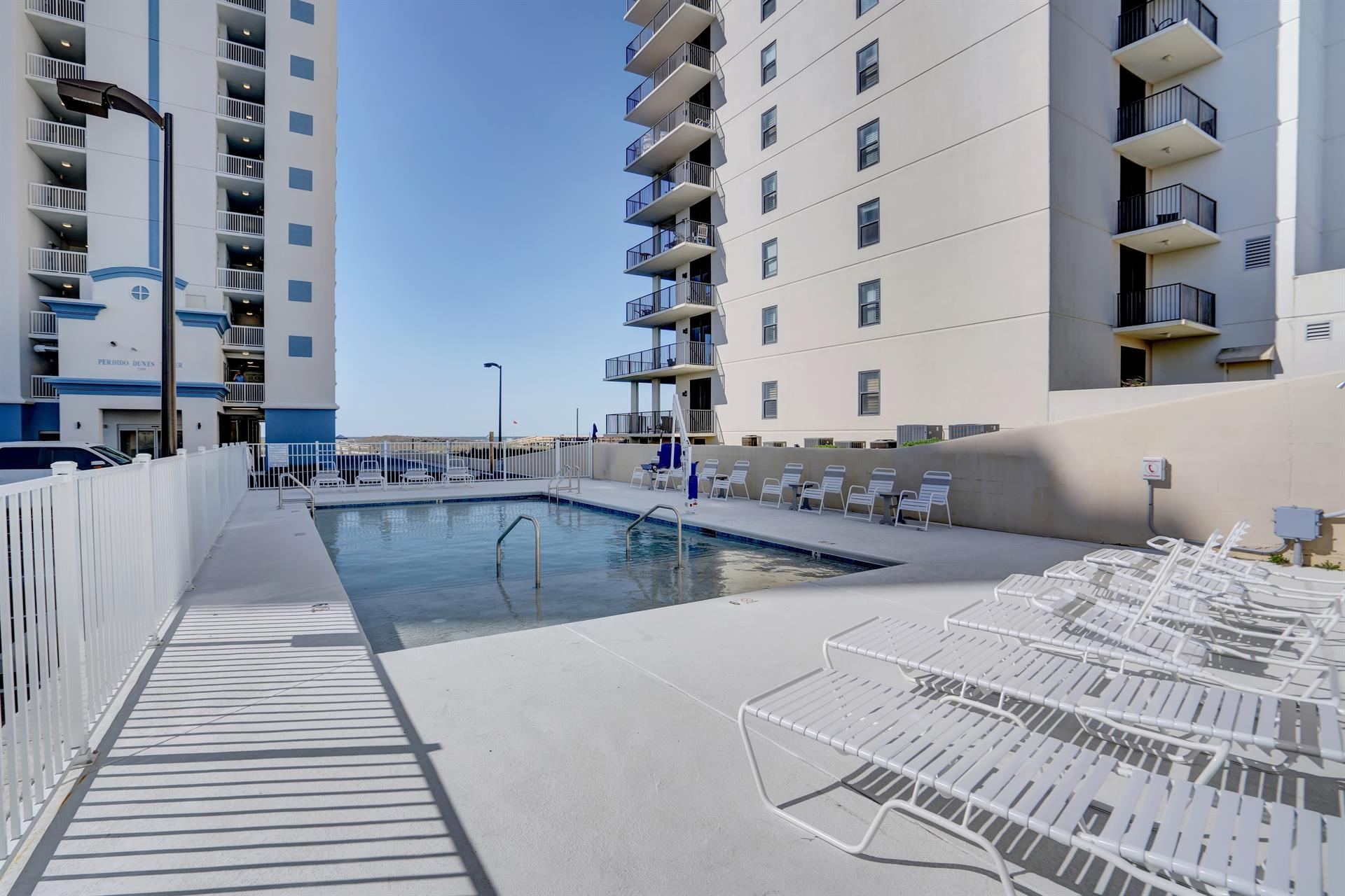 Gulf-front outdoor pool at Perdido Dunes Tower in Orange Beach, Alabama