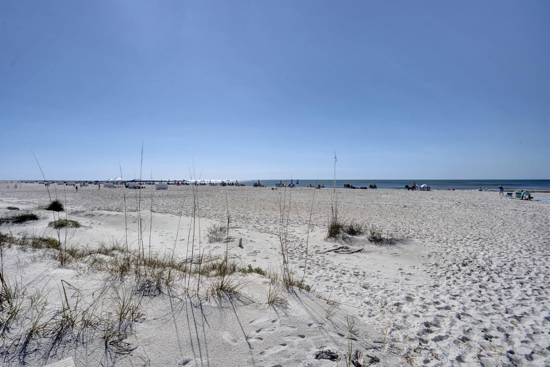 Boardwalk to the beach with the Perdido Dunes Tower condos behind in Orange Beach, Alabama