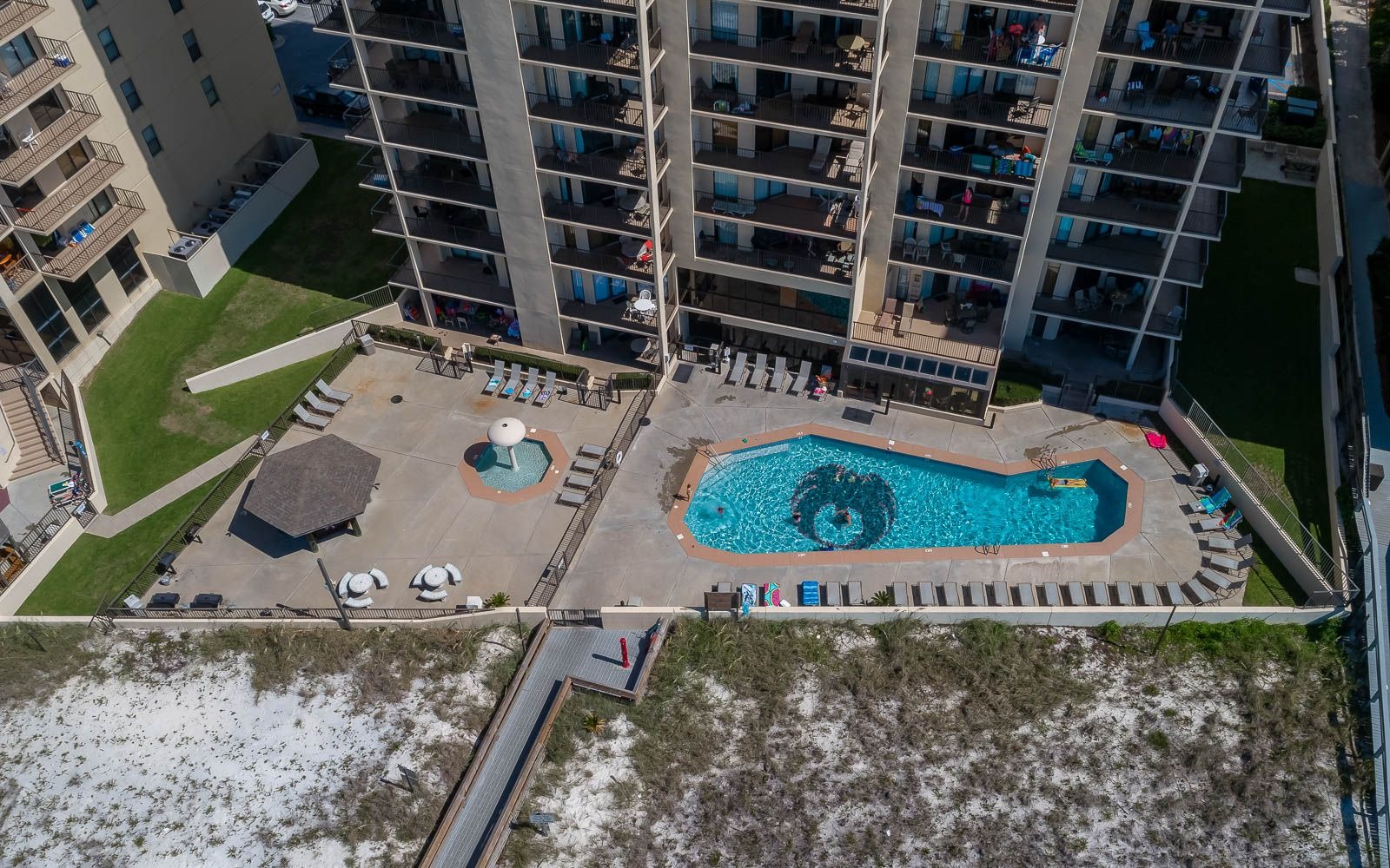 Aerial view of the pool deck and towers at Phoenix IV (Phoenix 4) in Orange Beach, Alabama