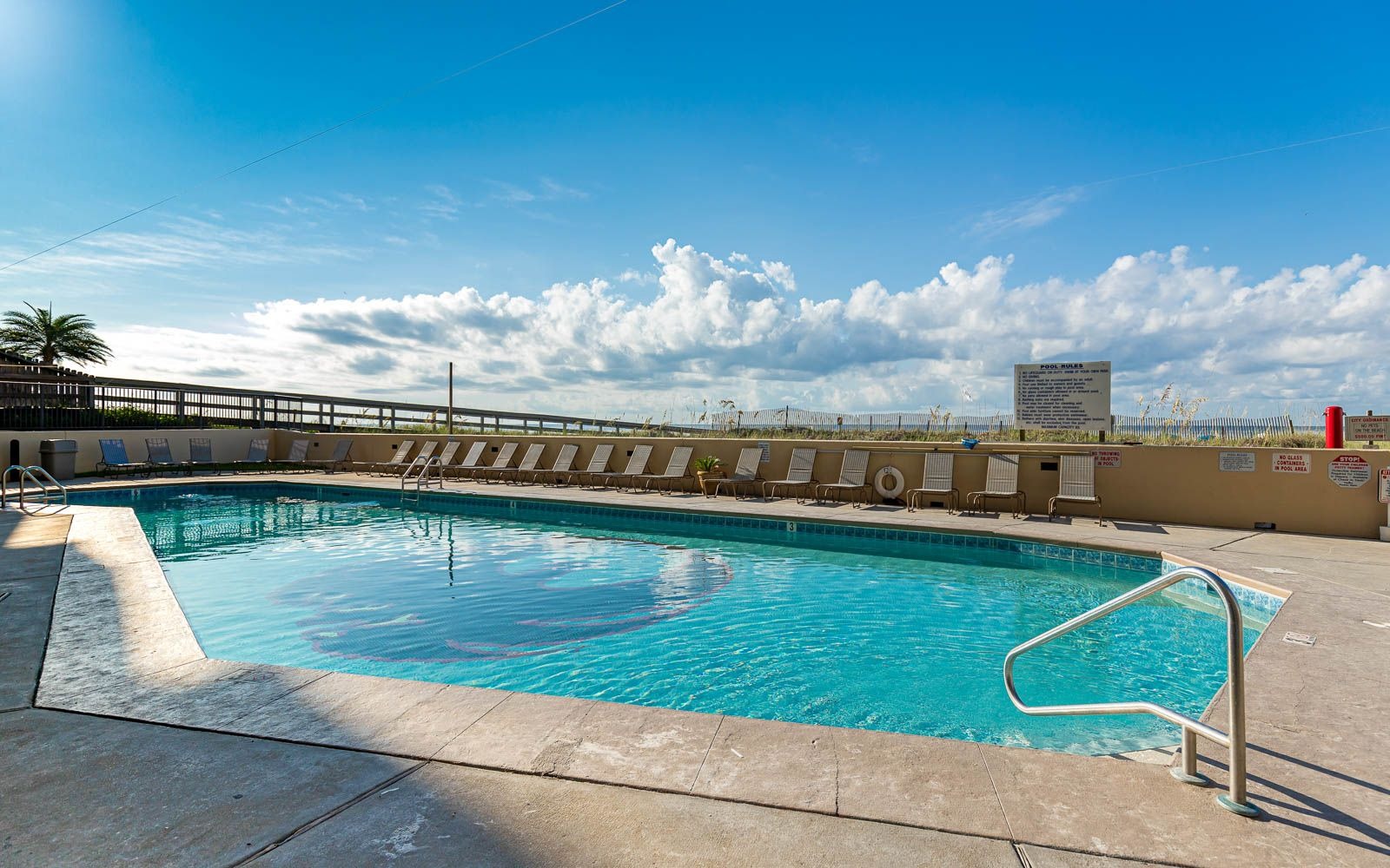 Outdoor pool and sun deck at Phoenix IV (Phoenix 4) in Orange Beach, Alabama