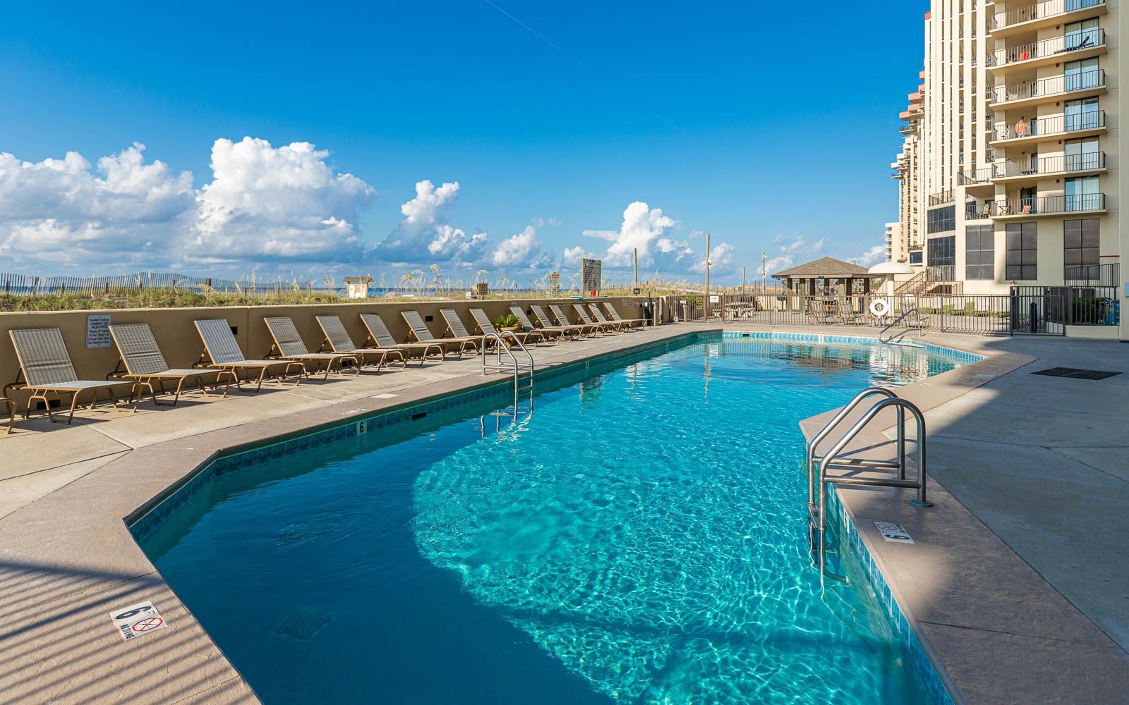 Gulf-front outdoor pool at Phoenix IV (Phoenix 4) in Orange Beach, Alabama