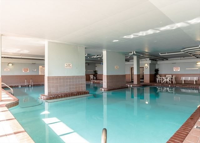 Indoor pool seating area at Phoenix VII in Orange Beach, Alabama