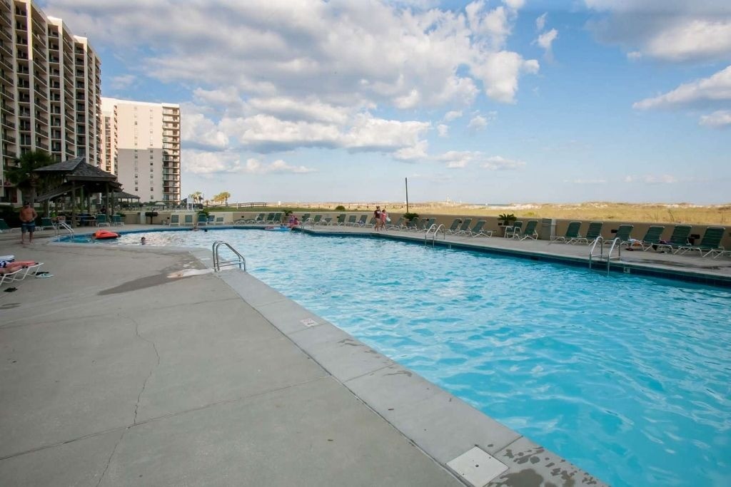 Outdoor pool and sun deck at Phoenix VII in Orange Beach, Alabama