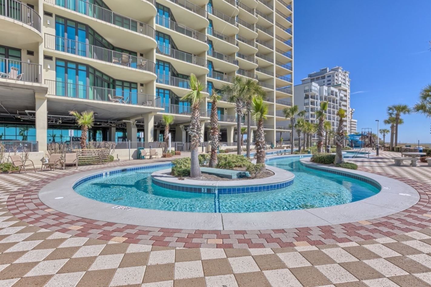 Lazy river and condo tower at Phoenix West in Orange Beach, Alabama