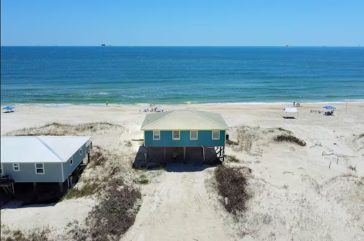 Small beach house on the sand facing the Gulf at Sandy Shack in Fort Morgan, Alabama