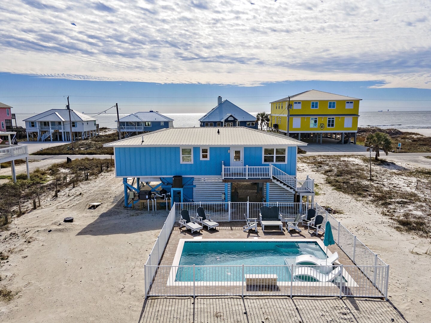 Blue beach house with private pool at Serenity Shores in Fort Morgan, Alabama