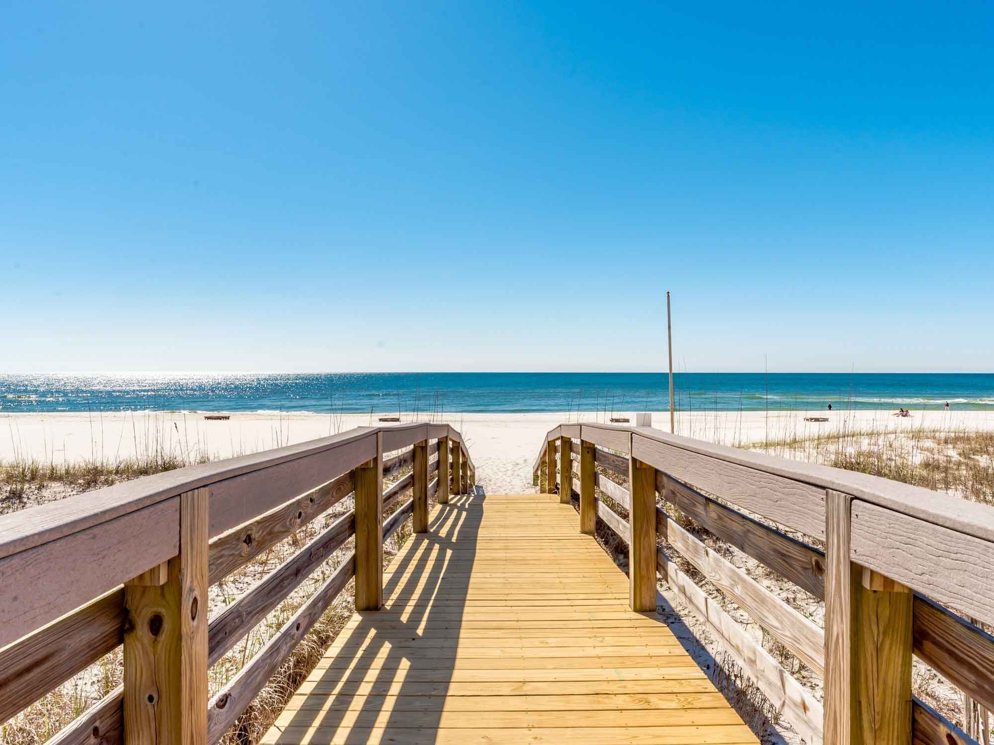 Wooden boardwalk leading to the beach and the Gulf