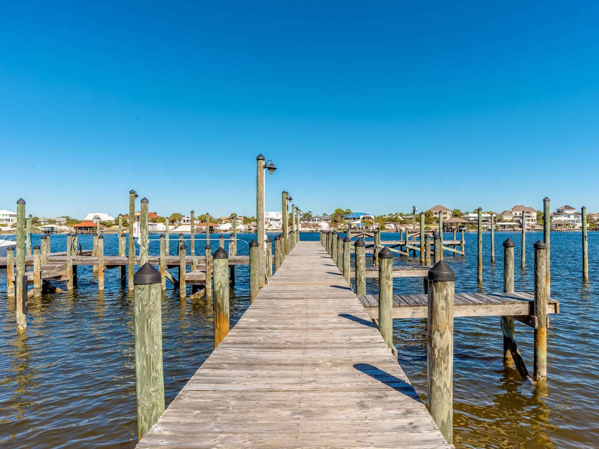 Wooden pier and boat docks at Shipwatch in Perdido Key, Florida