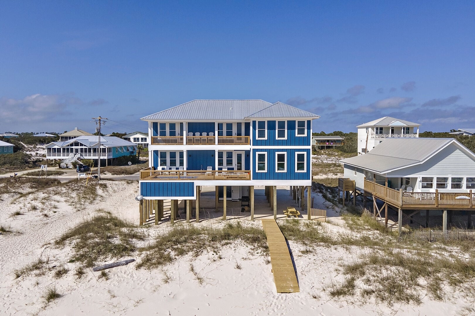 Blue beach house on the dunes at Summer Better in Fort Morgan, Alabama