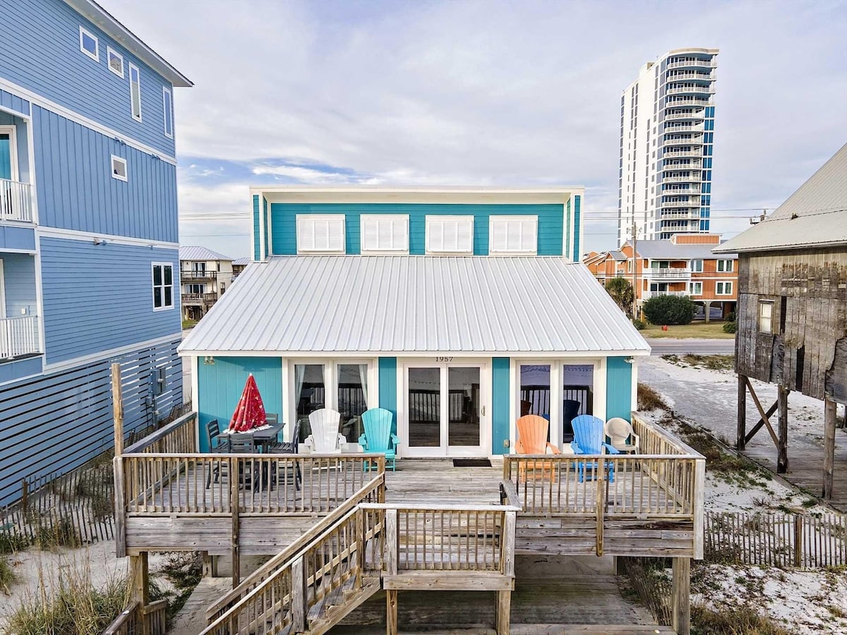 Teal beach bungalow with deck at West Beach Bungalow in Gulf Shores, Alabama